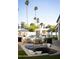 Beautiful outdoor living area with a sunken fire pit, ample seating, and an outdoor kitchen for entertaining at 6114 E Calle Del Norte --, Scottsdale, AZ 85251