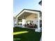 Beautiful outdoor patio with dining and lounge area overlooking well-manicured lawn at 6114 E Calle Del Norte --, Scottsdale, AZ 85251