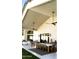 Spacious covered patio features modern lighting, an outdoor dining area, and comfortable lounge seating at 6114 E Calle Del Norte --, Scottsdale, AZ 85251