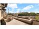 Relaxing outdoor space featuring a dining table and a built-in seating area around a fire feature at 6114 E Calle Del Norte --, Scottsdale, AZ 85251