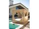 Unique poolside cabana with circular openings and comfortable seating by the pool at 6114 E Calle Del Norte --, Scottsdale, AZ 85251
