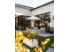 Relaxing poolside lounge with comfortable seating, modern umbrella, and sleek exterior at 6114 E Calle Del Norte --, Scottsdale, AZ 85251