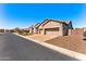 Charming home on a tree-lined street with landscaped front yard, complemented by a two-car garage and ample street parking at 6212 E Lonesome Trl, Cave Creek, AZ 85331