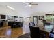 Open floor plan with kitchen island, dining area, and views of the backyard at 6228 W Caribbean Ln, Glendale, AZ 85306