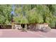 Charming home featuring mature shade trees and an inviting front yard at 6228 W Caribbean Ln, Glendale, AZ 85306