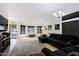 Spacious living room features neutral colors, bay windows, and a comfortable seating area at 6228 W Caribbean Ln, Glendale, AZ 85306