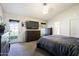 Comfortable main bedroom with plush carpet, a ceiling fan, and a private entry to the backyard at 6228 W Caribbean Ln, Glendale, AZ 85306