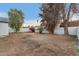 Large backyard with a privacy fence and mature trees, perfect for entertaining at 6812 S 41St Pl, Phoenix, AZ 85042