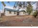 View of backyard featuring a bright home exterior, dual doors, and shaded privacy at 6812 S 41St Pl, Phoenix, AZ 85042