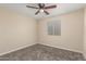 Bedroom featuring neutral walls, carpet flooring, ceiling fan, and window with blinds at 6812 S 41St Pl, Phoenix, AZ 85042