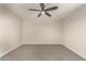 This bedroom features neutral walls, carpet flooring, and a ceiling fan at 6812 S 41St Pl, Phoenix, AZ 85042