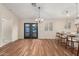 Light-filled dining area with stylish chandelier and easy access to both kitchen and backyard at 6812 S 41St Pl, Phoenix, AZ 85042