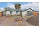 View of single story house with grey trim, 2 car garage, and some landscaping in progress at 6812 S 41St Pl, Phoenix, AZ 85042