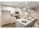 Modern kitchen featuring white cabinets, stainless steel appliances, and a spacious countertop at 6812 S 41St Pl, Phoenix, AZ 85042