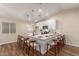 Modern kitchen featuring a large center island, white cabinets, stainless steel appliances, and wood-look flooring at 6812 S 41St Pl, Phoenix, AZ 85042