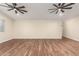 Bright and airy living room with wood-look tile, recessed lighting, and a minimalist design at 6812 S 41St Pl, Phoenix, AZ 85042