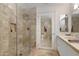 A luxurious bathroom features a glass shower, marble tile, and a modern vanity at 7121 E Rancho Vista Dr # 3001, Scottsdale, AZ 85251