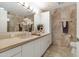 A bathroom vanity with double sinks, a large mirror, and modern lighting at 7121 E Rancho Vista Dr # 3001, Scottsdale, AZ 85251