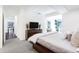 Contemporary bedroom featuring neutral tones, carpet, and a dresser with television at 7121 E Rancho Vista Dr # 3001, Scottsdale, AZ 85251