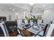 Elegant dining area with glass table and modern white chairs adjacent to the kitchen at 7121 E Rancho Vista Dr # 3001, Scottsdale, AZ 85251