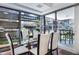 Bright dining area with glass table and access to outdoor views through large windows at 7121 E Rancho Vista Dr # 3001, Scottsdale, AZ 85251