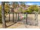 Gated dog park area featuring secure fencing and waste disposal station for residents and their pets at 7121 E Rancho Vista Dr # 3001, Scottsdale, AZ 85251