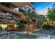 Stylish condominium exterior with balconies, lush tropical landscaping, and a tranquil water fountain at 7121 E Rancho Vista Dr # 3001, Scottsdale, AZ 85251