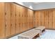 Locker room with bench seating and wood lockers at 7121 E Rancho Vista Dr # 3001, Scottsdale, AZ 85251