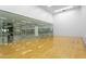 Indoor racquetball court with wood floor and full glass view of the exercise area at 7121 E Rancho Vista Dr # 3001, Scottsdale, AZ 85251