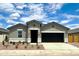 Charming single-story home with a well-manicured yard and a two-car garage at 8486 W Mantle Way, Florence, AZ 85132