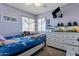 Cozy bedroom with a ceiling fan, white dresser, and a cute aquarium display at 9211 W Charleston Ave, Peoria, AZ 85382