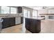 Kitchen with granite countertops, island, and stainless steel appliances with view into living room at 9211 W Charleston Ave, Peoria, AZ 85382