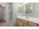 Bathroom featuring a glass-enclosed shower, tile flooring, and a vanity with framed mirror at 9455 E Raintree Dr # 1049, Scottsdale, AZ 85260