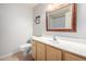 Cozy bathroom featuring a light wood vanity and neutral tile flooring at 9455 E Raintree Dr # 1049, Scottsdale, AZ 85260