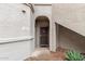 Unit entrance with security door, showing landscaping rocks and walkway at 9455 E Raintree Dr # 1049, Scottsdale, AZ 85260