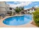 Community pool area with sun loungers and shaded cabana, perfect for relaxing at 9455 E Raintree Dr # 1049, Scottsdale, AZ 85260