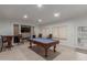 Spacious game room with pool table, recessed lighting, and tile flooring at 9627 W Reno View Dr, Peoria, AZ 85345