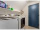 A bright laundry room featuring Samsung washer and dryer and shelving at 9627 W Reno View Dr, Peoria, AZ 85345