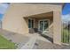 Covered back patio featuring sliding glass doors, perfect for enjoying the outdoors at 9965 W Devonshire Dr, Arizona City, AZ 85123