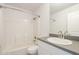 Bright bathroom featuring a shower-tub combination and a modern vanity with a gray countertop at 9965 W Devonshire Dr, Arizona City, AZ 85123