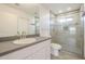 Modern bathroom with glass shower, decorative tile, and white vanity at 9965 W Devonshire Dr, Arizona City, AZ 85123