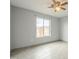 Bedroom with ceiling fan, window, and neutral paint; bright, airy space at 9965 W Devonshire Dr, Arizona City, AZ 85123