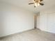 Bright bedroom with ceiling fan, neutral paint, and closet at 9965 W Devonshire Dr, Arizona City, AZ 85123