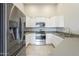 Modern kitchen featuring stainless steel appliances, ample cabinet space, and granite countertops at 9965 W Devonshire Dr, Arizona City, AZ 85123