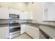 Clean kitchen design with stainless steel appliances and gray countertops at 9965 W Devonshire Dr, Arizona City, AZ 85123