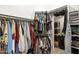 Walk-in closet provides substantial storage with rods, shelves, and organization bins at 101 N 7Th St # 137, Phoenix, AZ 85034