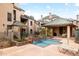 Outdoor swimming pool with lounge chairs surrounded by community homes at 101 N 7Th St # 137, Phoenix, AZ 85034