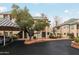 Condominium complex featuring desert landscaping, covered parking, and neutral color palette at 101 N 7Th St # 137, Phoenix, AZ 85034