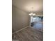 Dining room with modern lighting, sliding door, and seamless flooring at 10328 E Michigan Ave, Sun Lakes, AZ 85248