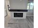 Modern fireplace featuring sleek design and seamless flooring at 10328 E Michigan Ave, Sun Lakes, AZ 85248